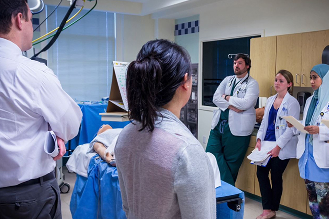 Dr. Jason Haney leads discussion in MUSC’s simulation lab.