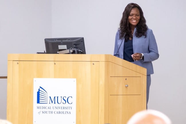 Shea Manigo speaking at white coat event
