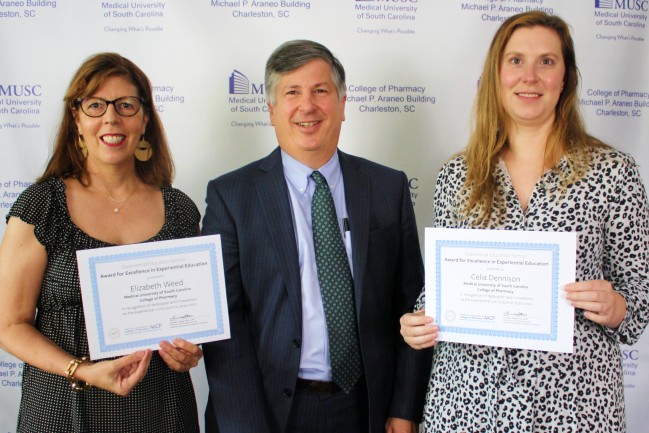 Elizabeth Weed, Philip Hall, Celia Dennison with recognition certificates