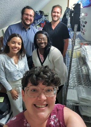 Mallory George (bottom) P2, Itxamaris Ocasio (middle left) P1, Brianna Williams (middle right) P3, Matt Chilton (top left) P1, and Connor McLean (top right) P2, shown in the supply closet of the Berkeley County Coroner's Office, right next to the white body bags.