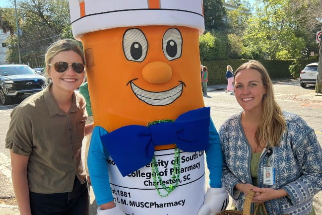 Caroline Newsome, Phil the Pill, and Madison Riley Protzman after the St. Patrick's Day Parade